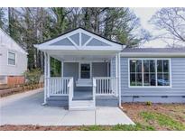 Charming home featuring a covered front porch with a porch swing and beautiful, neutral color palette at 1268 Kenilworth Sw Dr, Atlanta, GA 30310