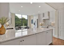 Spacious kitchen with granite countertops and stainless steel appliances at 750 Park Ne Ave # 6E, Atlanta, GA 30326