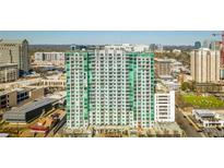 High-rise building aerial view, showcasing its modern design and urban setting at 250 Pharr Rd # 712, Atlanta, GA 30305