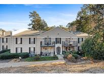 Attractive brick front of a two-story building with balconies and landscaping at 3486 Essex Ave # 88, Atlanta, GA 30339