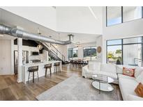 Open living area with high ceilings, hardwood floors, and ample natural light at 260 18Th Nw St # 10311, Atlanta, GA 30363