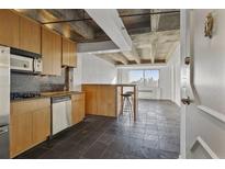 Modern kitchen with stainless steel appliances and wood cabinets at 2479 Peachtree Ne Rd # 1710, Atlanta, GA 30305