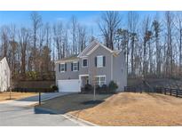 Charming two-story home with gray siding, black shutters, and a well-manicured front yard at 4770 Alford Commons, Cumming, GA 30028