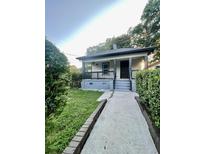Charming bungalow with front porch and landscaped yard at 346 Tazor St, Atlanta, GA 30314