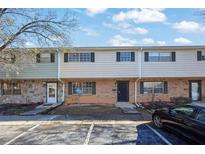 Brick townhouse exterior with parking and landscaping at 4701 Flat Shoals Rd # 49C, Union City, GA 30291