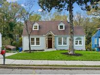 Charming renovated home with light gray exterior, stone accents, and manicured lawn at 1183 Cahaba Dr, Atlanta, GA 30311