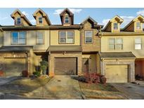 Attractive townhome with two-car garage and dormer windows at 2916 Hillside Pl, Decatur, GA 30034