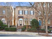 Attractive brick front exterior with a charming porch at 3156 Neal Ct, Cumming, GA 30041