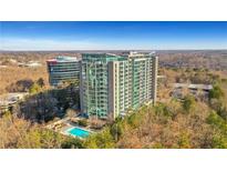 Luxury high-rise condo building with pool and scenic views at 3300 Windy Ridge Se Pkwy # 1603, Atlanta, GA 30339