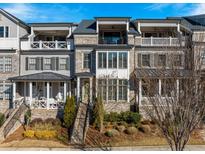 Three-story townhome with brick facade, balconies, and landscaping at 364 Concord St, Alpharetta, GA 30009