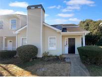 Inviting exterior of charming house, featuring a well-maintained lawn and walkway at 2190 Wellington Cir, Lithonia, GA 30058