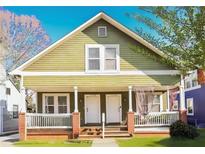 Charming duplex with a green exterior, two entrances, and a brick porch at 1177 Arlington Ave, Atlanta, GA 30310