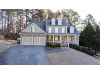 Two-story house with stone accents, large porch, and three-car garage at 37 Waterstone Se Dr, Cartersville, GA 30121