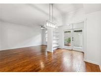 Bright dining room with hardwood floors and built-in shelving at 955 Juniper Ne St # 1016, Atlanta, GA 30309