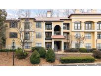 Attractive three-story building with terracotta accents and landscaping at 3777 Peachtree Ne Rd # 713, Atlanta, GA 30319