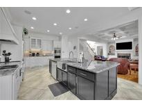 Spacious kitchen with island, stainless steel appliances, and granite countertops at 8069 Kenstone Ct, Atlanta, GA 30350