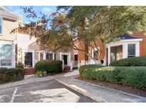 Front view of charming townhouses with manicured landscaping at 7500 Roswell Rd # 18, Sandy Springs, GA 30350