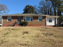 Brick ranch home with a spacious yard at 1964 E Lakeside Dr, Decatur, GA 30032