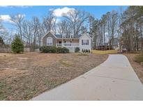 Two-story house with stone accents and a large yard at 954 Josie Ct, Lawrenceville, GA 30045
