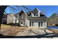 Two-story house with stone accents and a two-car garage at 4225 Ward Bluff Dr, Ellenwood, GA 30294