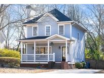 Charming two-story home with a welcoming front porch and a well-maintained yard at 110 Bowen Sw Cir, Atlanta, GA 30315