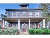 Charming two-story home with a welcoming front porch and well-maintained landscaping at 1520 Vassar Ave, College Park, GA 30337