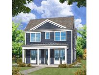 Two-story craftsman style home with blue siding, white trim, and a front porch at 29 Hydrangea Unit 72 Way, Auburn, GA 30011
