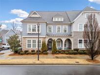 Stunning two-story home with gray siding and brick accents at 228 Dawson Dr, Woodstock, GA 30188
