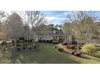 Ranch style home with mature trees and landscaping at 75 Bent Arrow Dr, Stockbridge, GA 30281