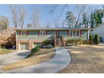 Ranch style home with attached garage and landscaped yard at 2500 Cottonwood Dr, Marietta, GA 30066