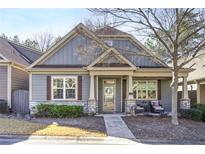 Charming craftsman style home with gray siding, stone accents, and welcoming porch at 340 Glens Way, Woodstock, GA 30188