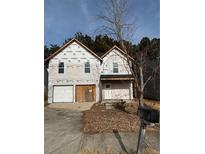 Two-story house under construction, featuring a white exterior and a two-car garage at 2615 Virginia Cv, Riverdale, GA 30296