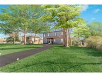 Modern two-story house with a spacious lawn and long driveway at 2049 Mcafee Rd, Decatur, GA 30032