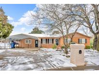 Brick ranch home with carport and snow covered yard at 2773 Parcel Rd, Austell, GA 30106