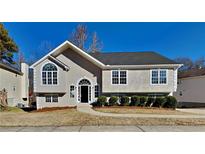 Attractive single-story home with a landscaped lawn and walkway at 5939 Graywood Se Cir, Mableton, GA 30126