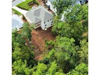Aerial view of a new house and surrounding community, showcasing the neighborhood's landscape at 4412 Brookview Se Dr, Atlanta, GA 30339