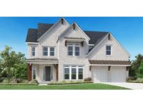 Two-story house featuring white brick, brown roof, and a two-car garage at 6745 Dahlgren Ct, Cumming, GA 30028