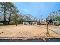 Ranch style home with a spacious yard at 3693 Aldea Dr, Decatur, GA 30032