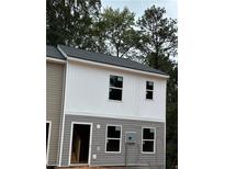 New two-story townhome with gray and white siding at 7268 Crestside Dr # 64, Austell, GA 30168