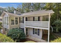 Charming two-story home with covered porch and well-maintained landscaping at 1608 Vicksburg Pl, Sandy Springs, GA 30350