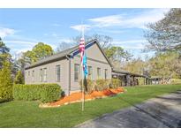 Gray house with a large yard and covered porch at 6585 Queen Mill Se Rd, Mableton, GA 30126