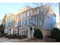 Three-story townhouses with brick and siding exteriors, landscaping, and attached garages at 3857 Felton Hill Sw Rd # 9, Smyrna, GA 30082