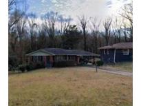 Ranch house with a large yard and mature trees at 2815 Se Rockcliff Se Rd, Atlanta, GA 30316