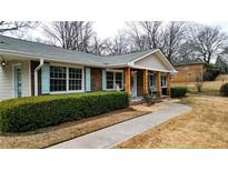 Ranch style home with brick accents, light-colored siding, and a covered porch at 3649 Pinehill Cir, Acworth, GA 30101