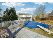 Home with inground pool, deck, and diving board; backyard oasis at 360 Wynbrook Dr, Mcdonough, GA 30253
