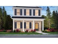 Two-story home with brick and siding, featuring a front porch and landscaping at 1260 Firefly Field Trce Trce, Lawrenceville, GA 30045