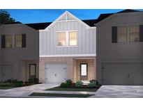 Charming exterior showcasing a well-manicured lawn and a one car garage at 4235 Holland Grove Rd, Lawrenceville, GA 30044