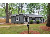 Charming single-story home with a well-maintained lawn and inviting curb appeal at 1929 Hazelwood Se Dr, Marietta, GA 30067