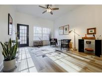 Bright sunroom features hardwood floors, a comfy seating area, and access to a deck at 1635 Briarcliff Ne Rd # 9, Atlanta, GA 30306