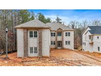 Two-story house with brick facade and a large front yard at 4271 Matisse Ln, Fairburn, GA 30213